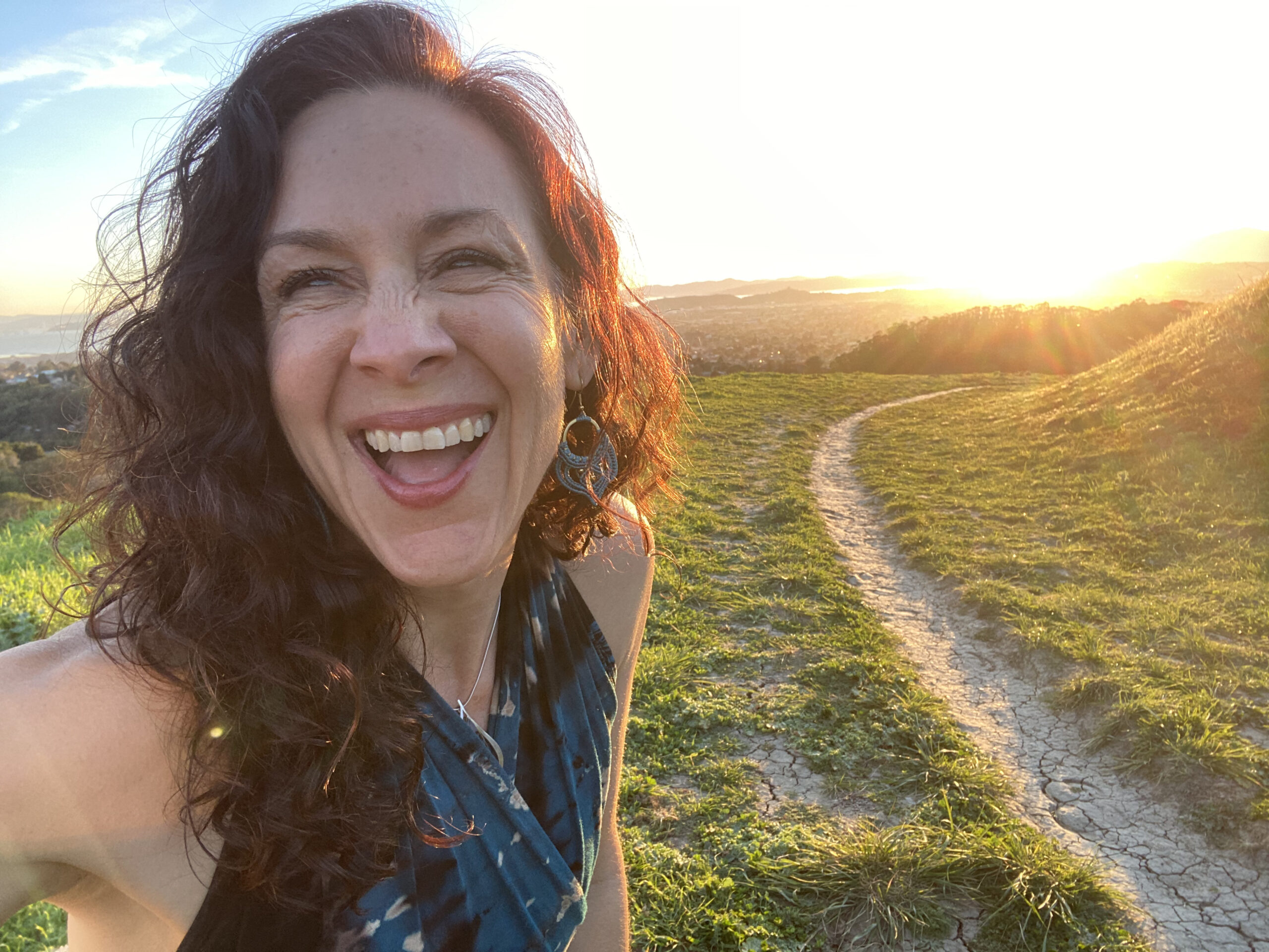 Angela Luna smiling in the fields